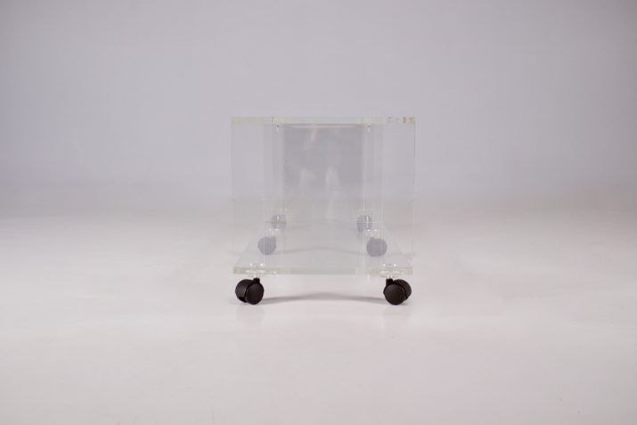 Low transparent plexiglass sideboard.