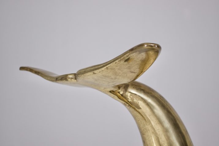 Feet of consoles with dolphins in solid brass.